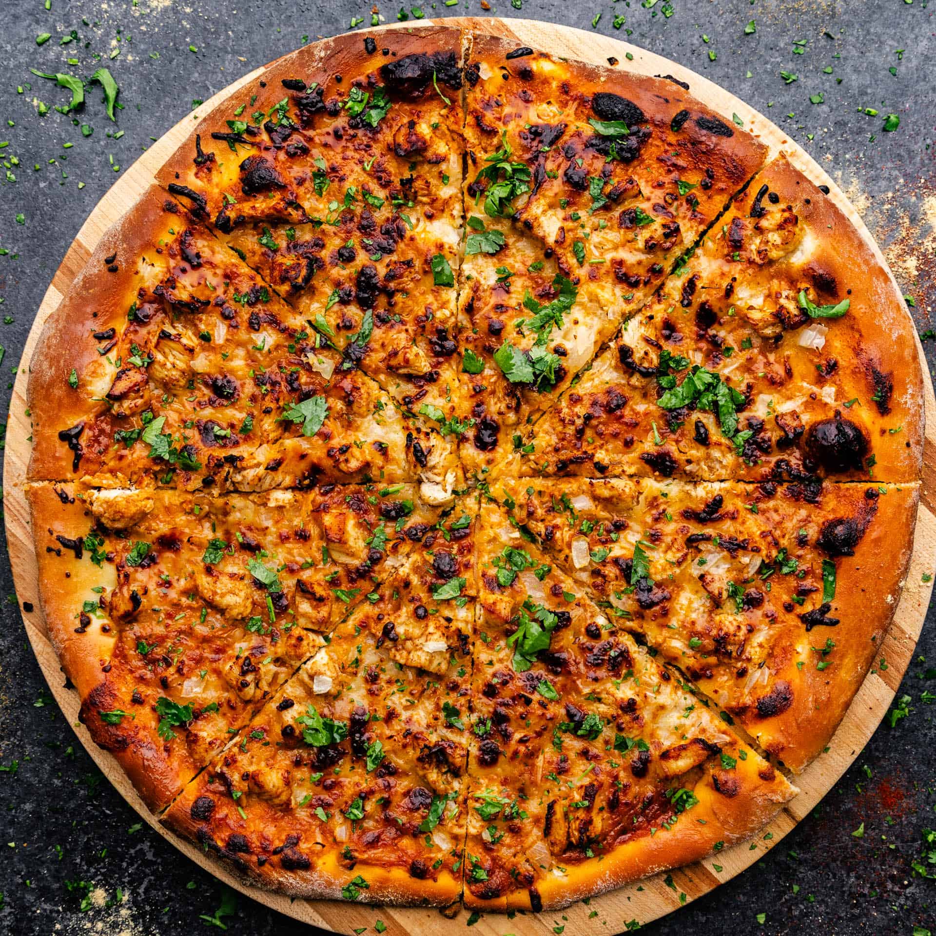 A whole chicken tikka masala pizza baked to golden perfection.