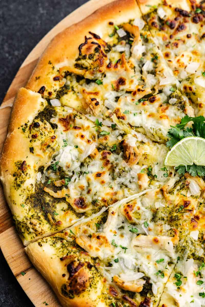 A close-up of the cilantro lime pizza topping, ready to be scooped out with a slice.