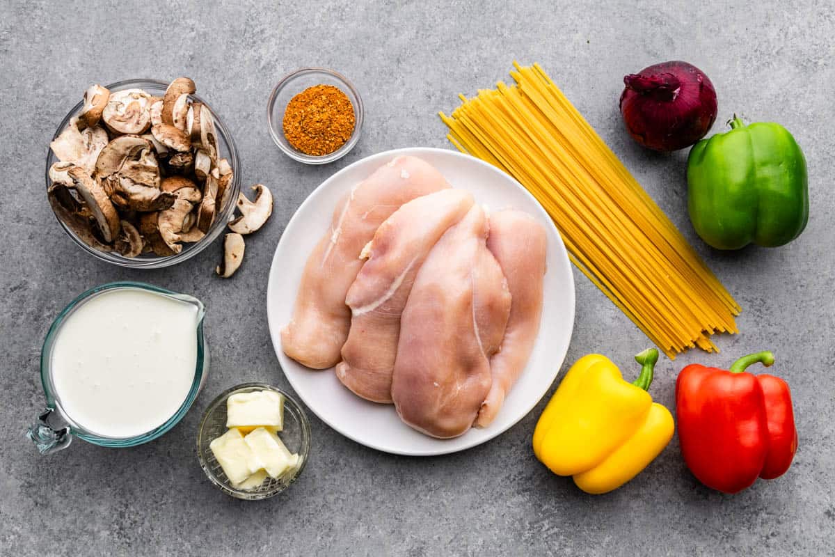 An overhead view of the ingredients needed to make a pot of spaghetti.