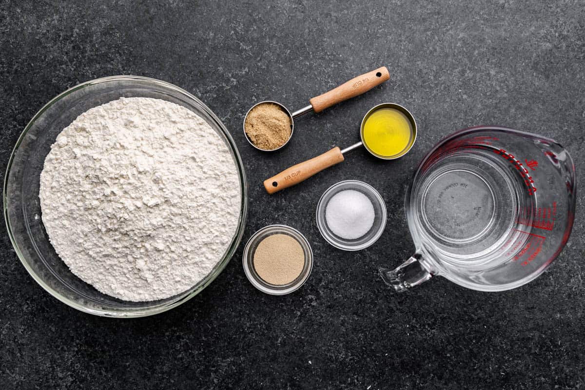 An overhead view of the ingredients needed to make refrigerator pizza dough.