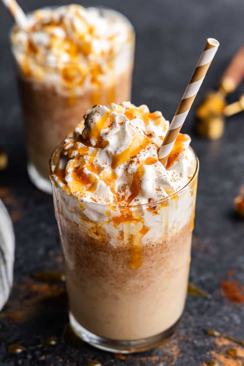 Close up view of pumpkin spice frappes drizzled with caramel.