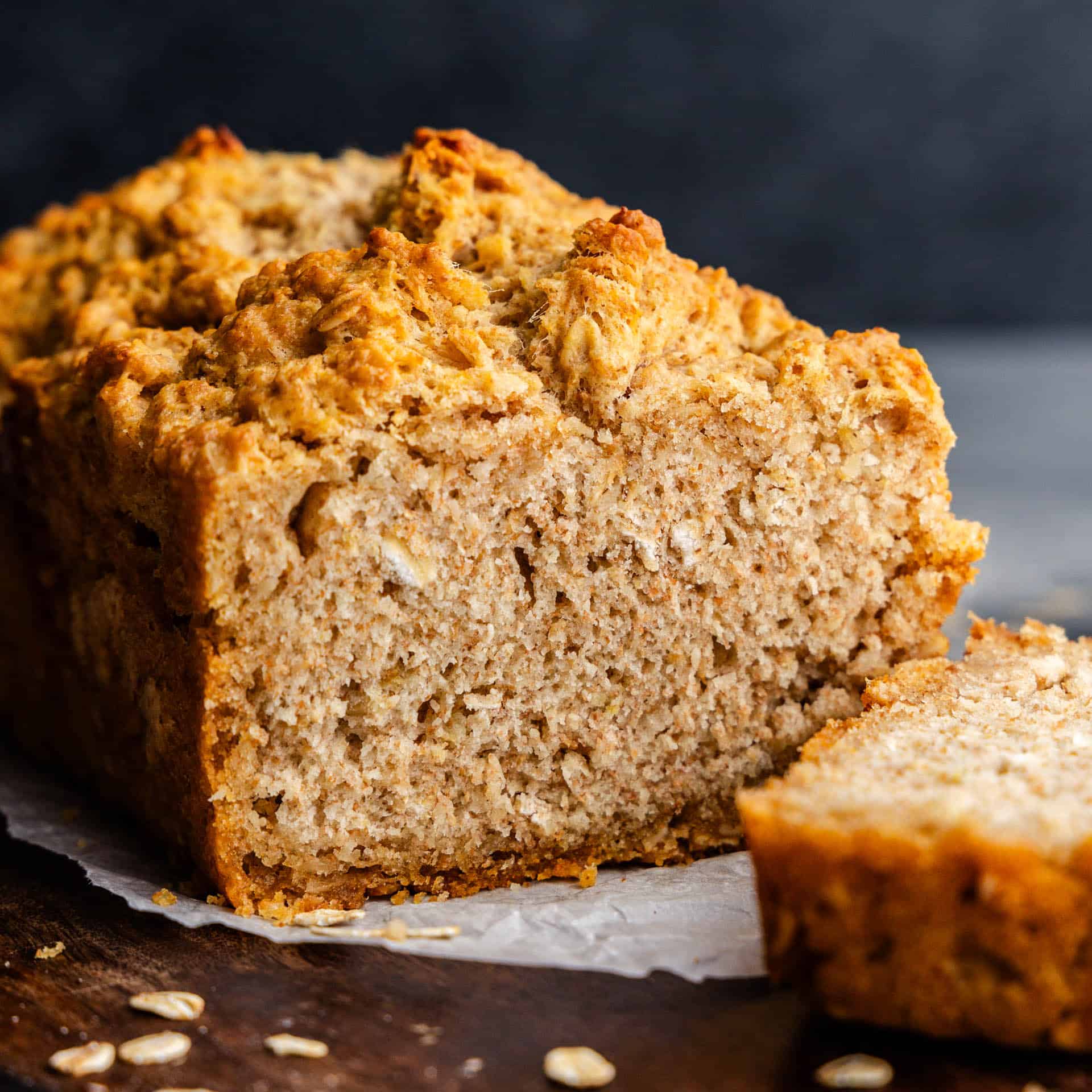 A loaf of beer bread that has been sliced open so you can see the inside.