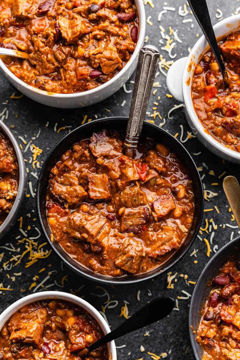 Overhead view of several bowls of chili.