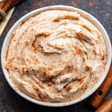 An overhead view of a bowl of cinnamon cream cheese butter.