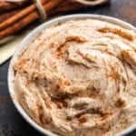 A close up overhead view of a bowl of cinnamon cream cheese butter.