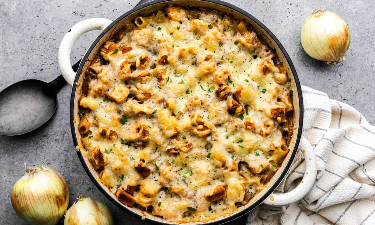 An overhead view of a pot of French onion pasta casserole.