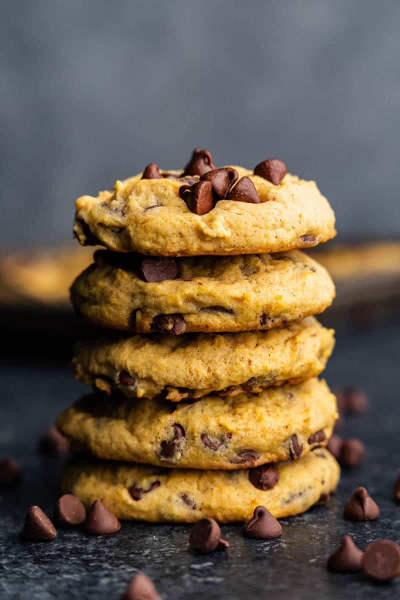 A tower of stacked pumpkin chocolate chip cookies.