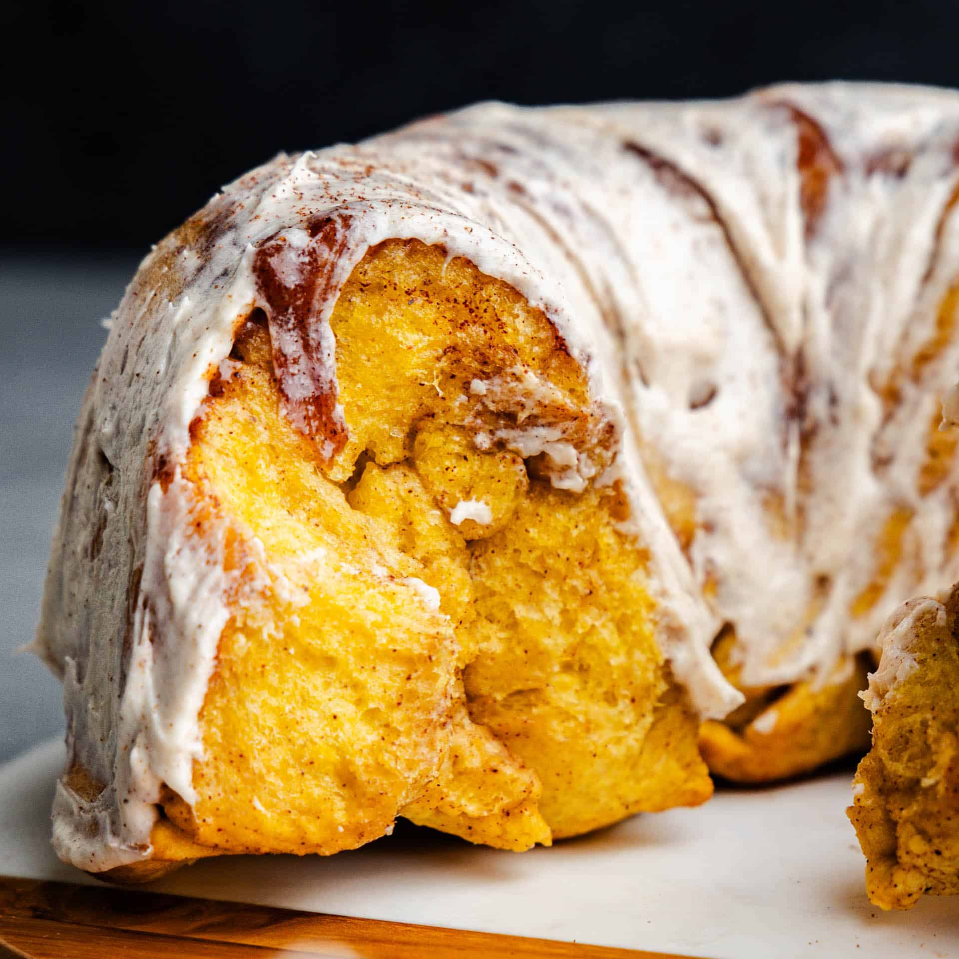 A close up view of the gooey inside of pumpkin pull apart monkey bread.