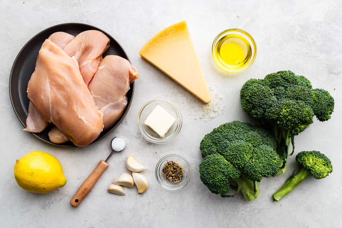 An overhead view of the ingredients needed to make a lemon garlic chicken broccoli bake.