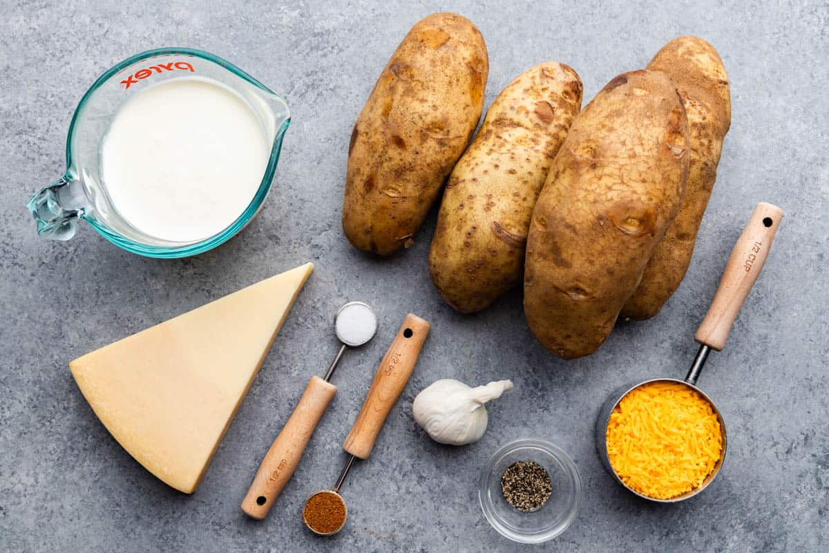 An overhead view of the ingredients needed to make slow cooker scalloped potatoes.