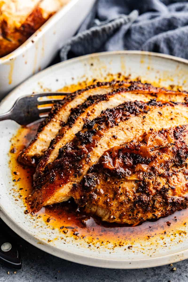 A serving of sliced ​​Cajun fried turkey breast on a plate.