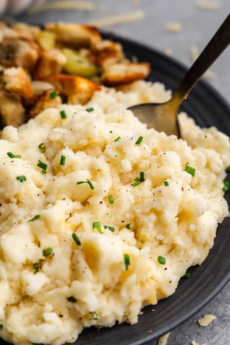 homemade smoked gouda mashed potatoes on black plate