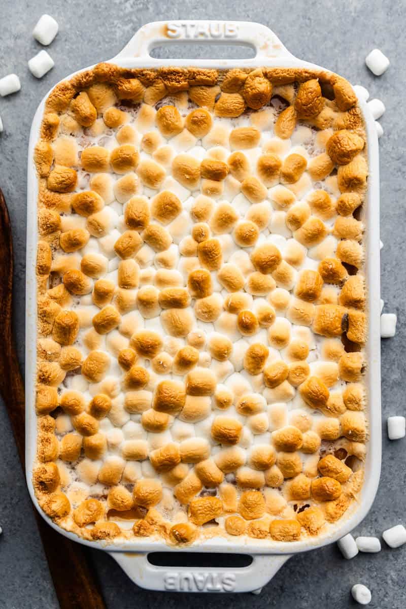 An overhead view of a pan of sweet potato casserole with marshmallows.