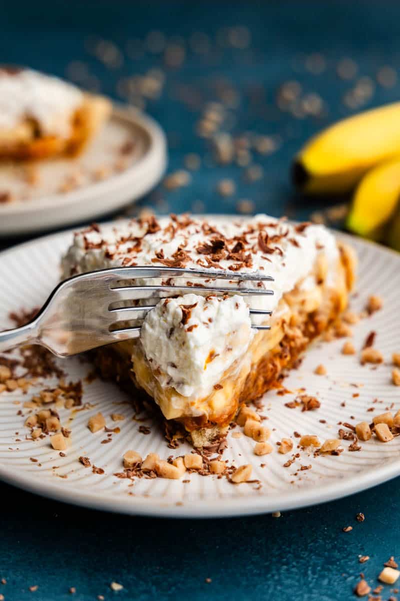 slice of toffee crunch banoffee pie on white plate