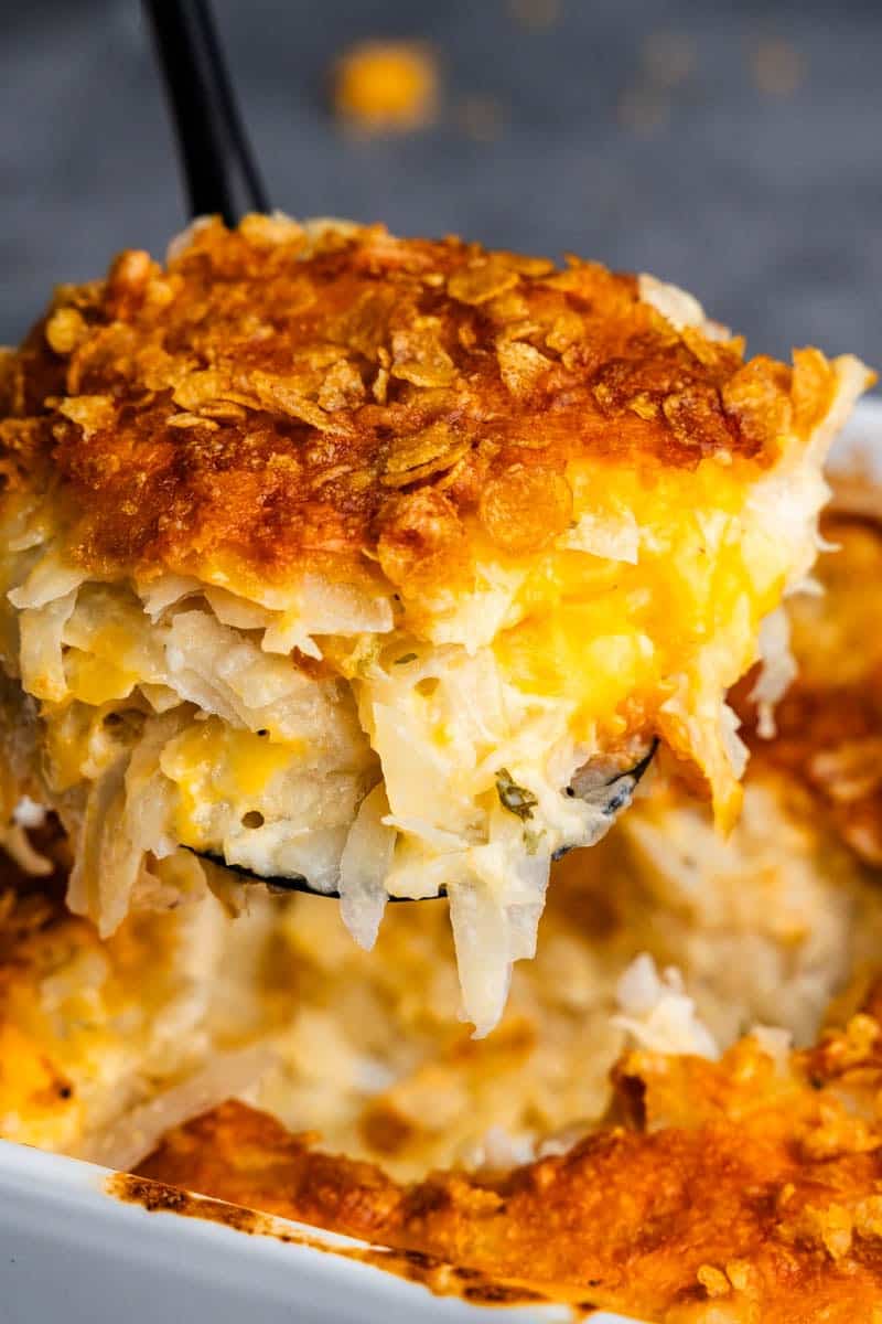 Helping funeral potatoes from the pan.