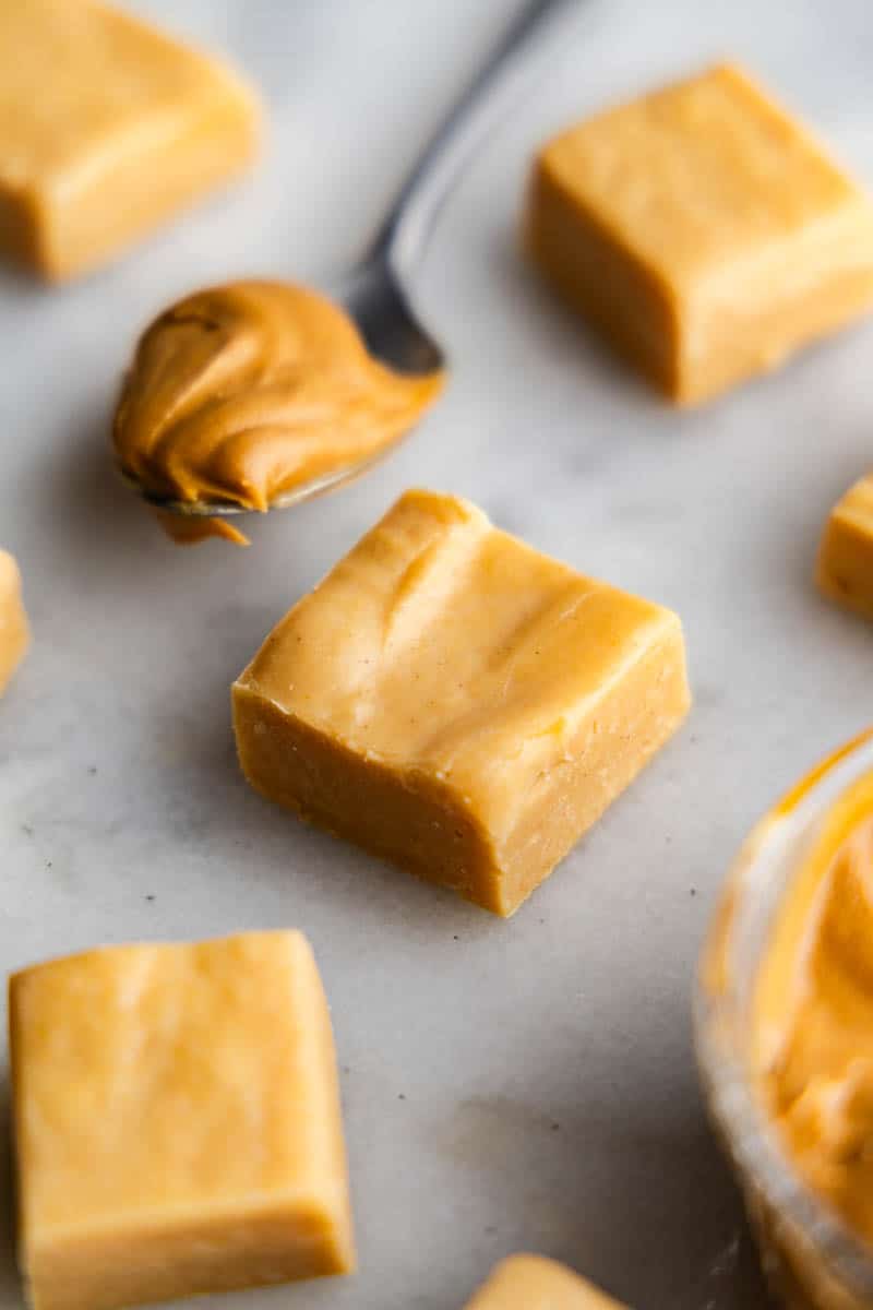 square pieces of peanut butter fudge on table