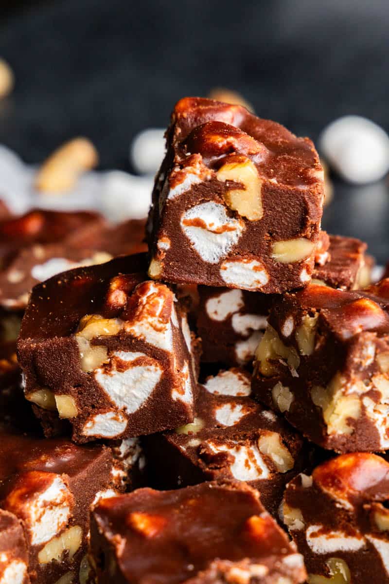 A stack of pieces of fantasy fudge with marshmallows and walnuts.