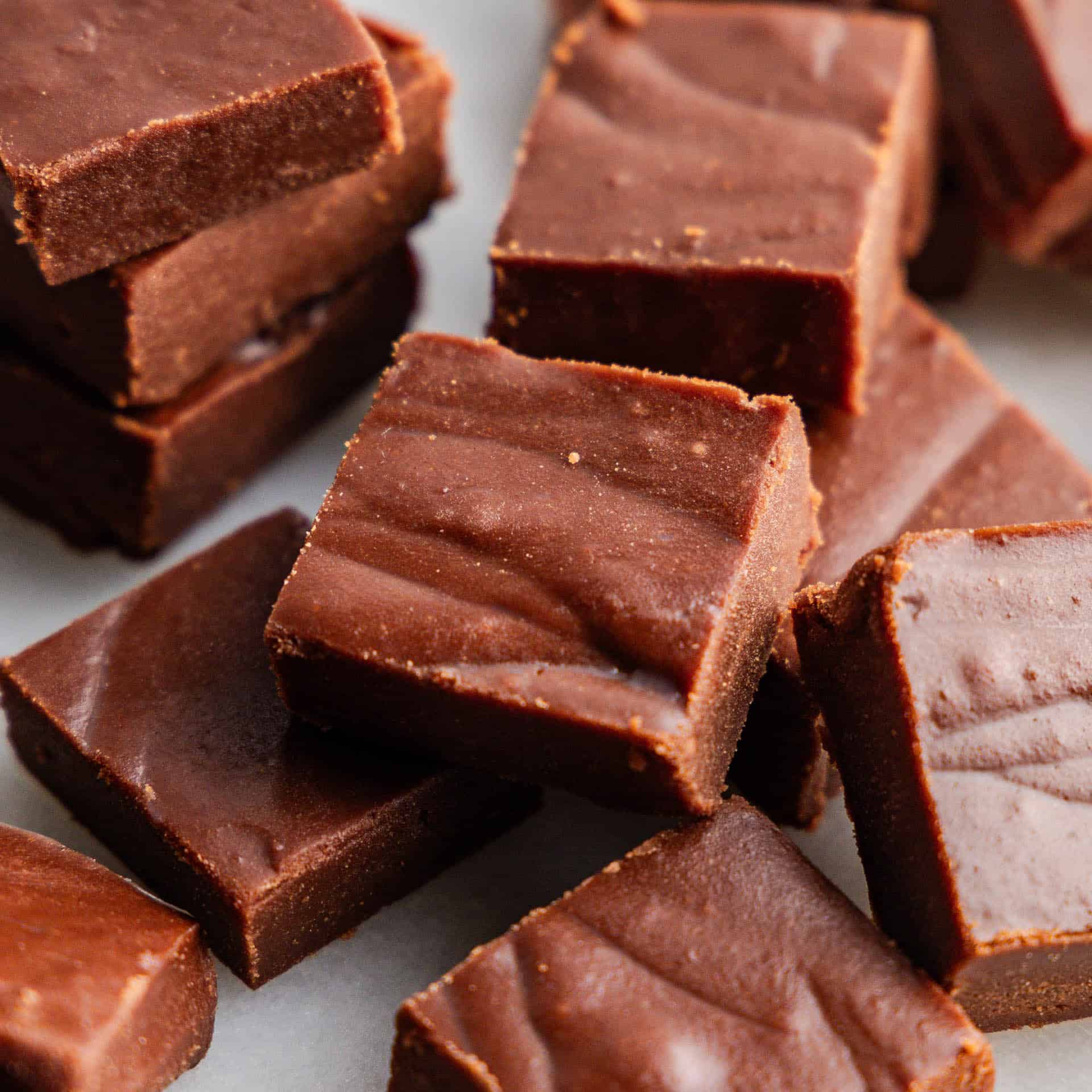 A close up view of a pile of pieces of homemade fudge.