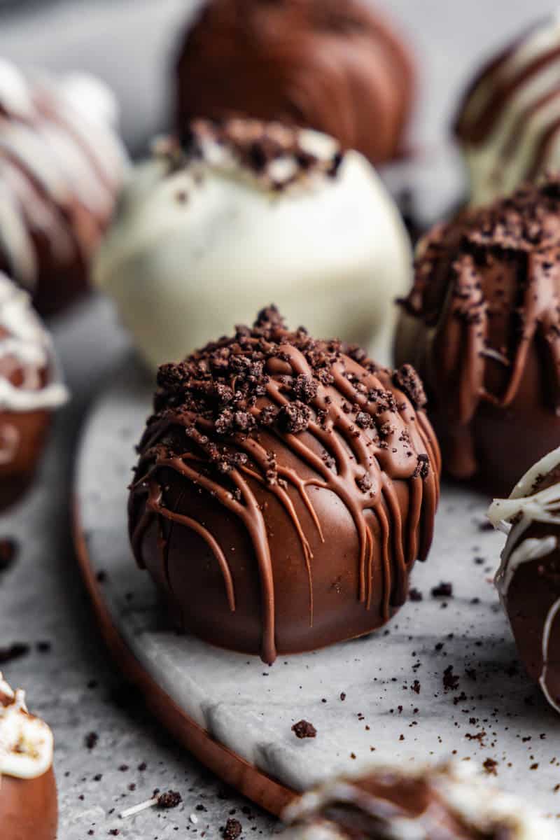 side view of homemade oreo truffles on a plate