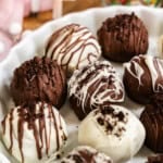 Oreo truffles on a white platter.