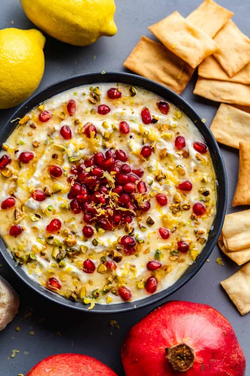 skillet of freshly baked pomegranate pistachio whipped feta