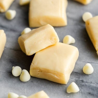 Pieces of vanilla fudge on a marble counter.