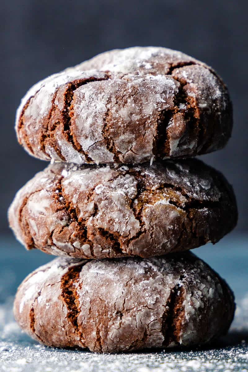 A stack of 3 chocolate crinkle cookies.