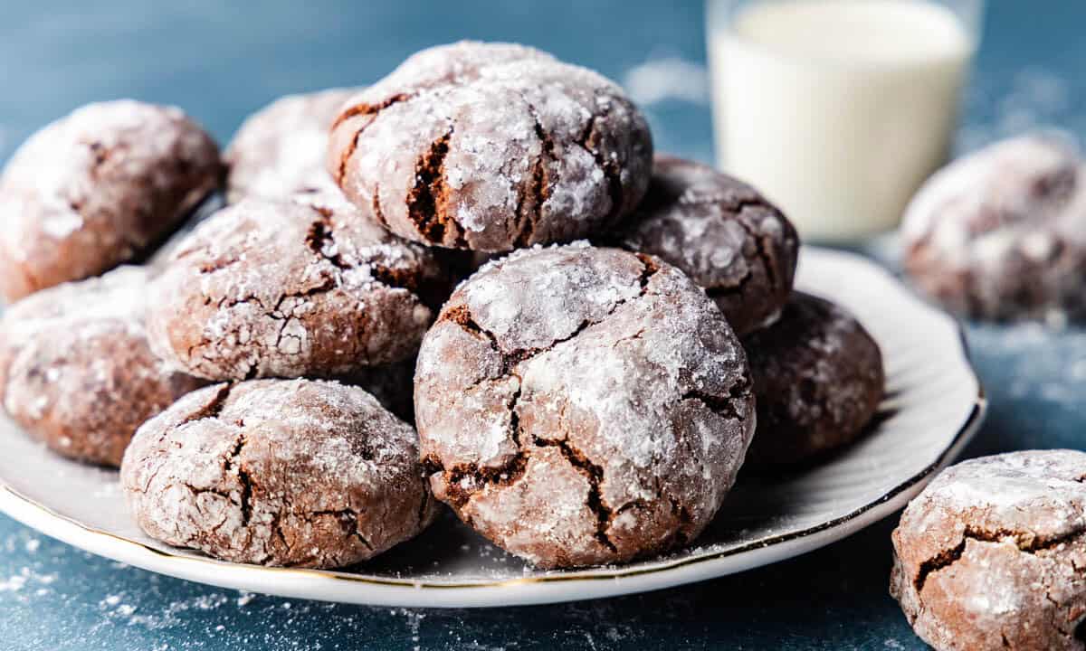 A plate of chocolate crinkles cookies piled high.