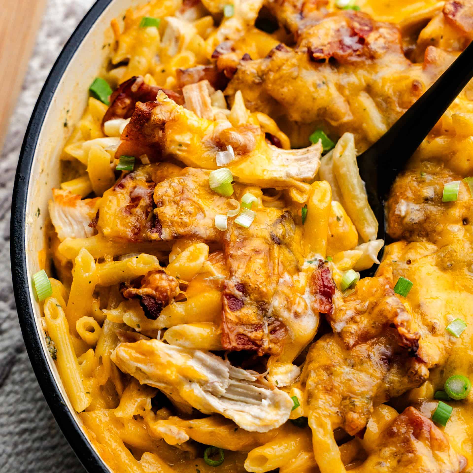 An overhead view of a skillet full of crack chicken casserole.