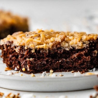 slice of german chocolate sheet cake on white plate