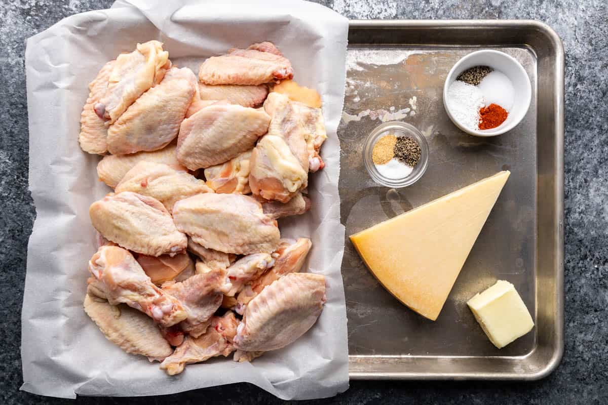 An overhead view of the ingredients needed to make garlic parmesan chicken wings.