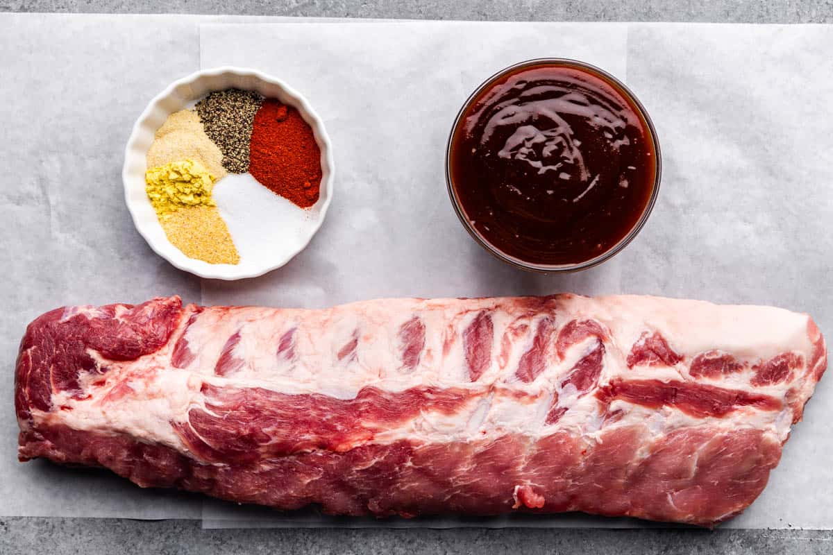 An overhead view of the ingredients needed to make ribs in the slow cooker.