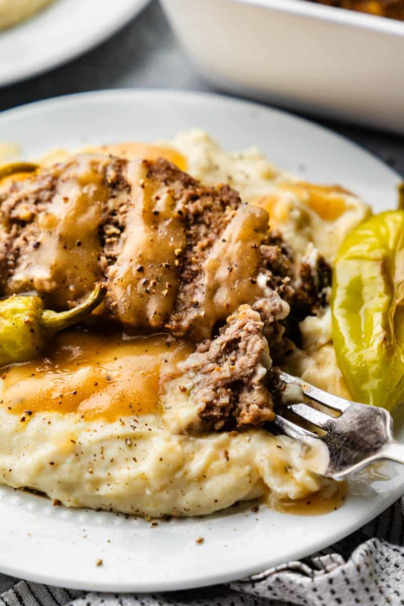 mississippi pot roast meatloaf on a plate with a fork