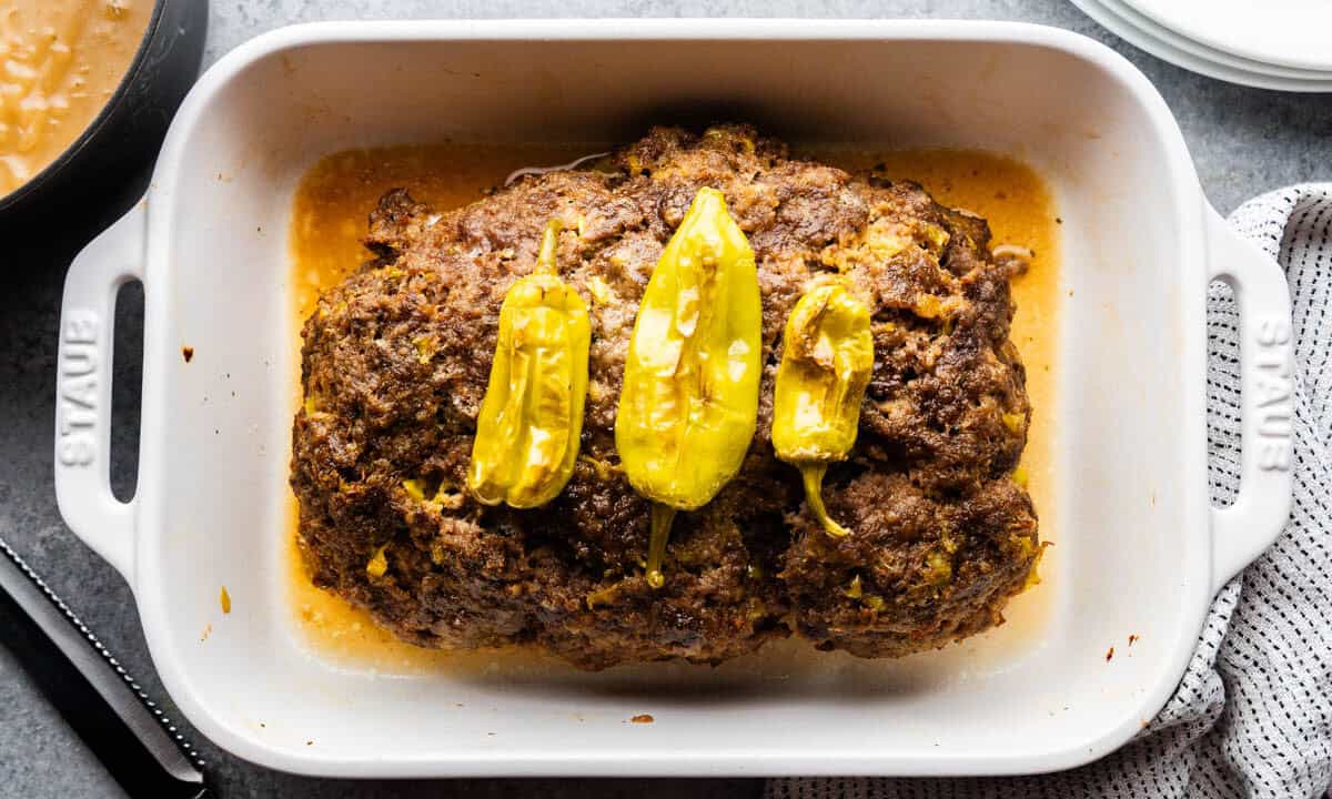 top view of mississippi pot roast meatloaf in large white baking dish