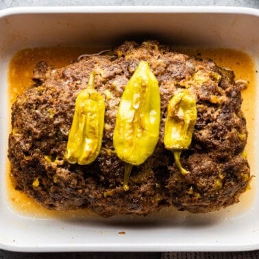 top view of mississippi pot roast meatloaf in large white baking dish