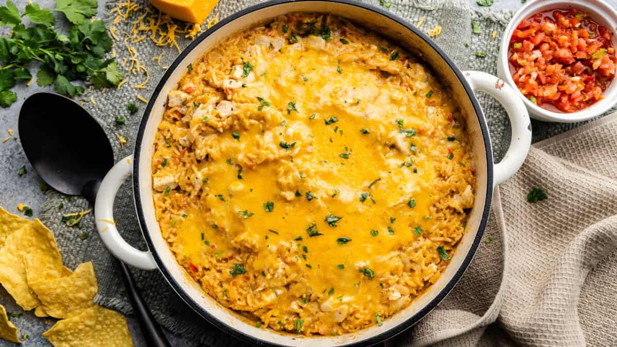 An overhead view of a pot of queso chicken and rice.