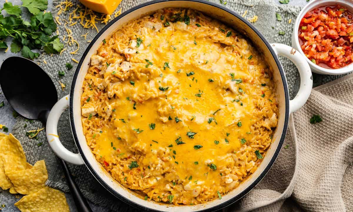 An overhead view of a pot of queso chicken and rice.