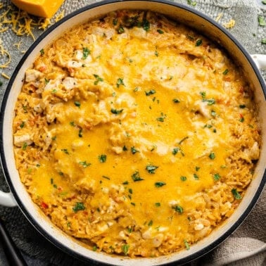 An overhead view of a pot of queso chicken and rice.