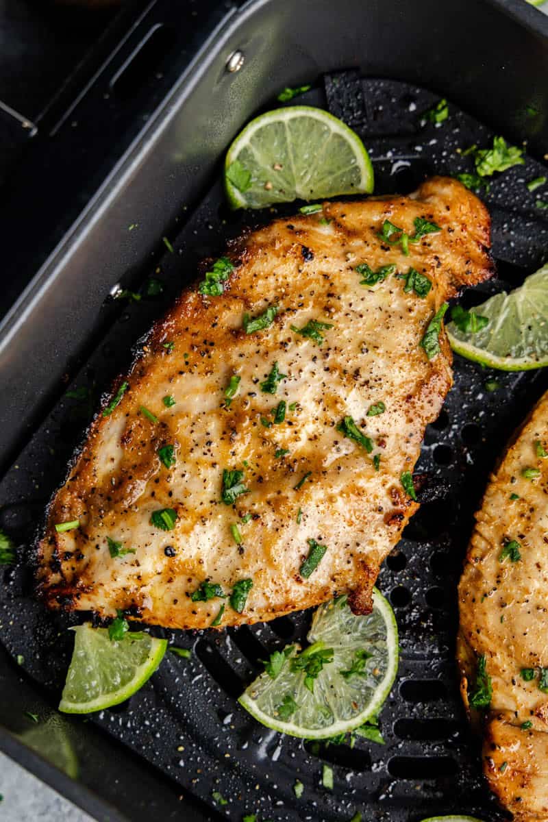 Closeup of Garlic Lime Chicken in an air fryer.