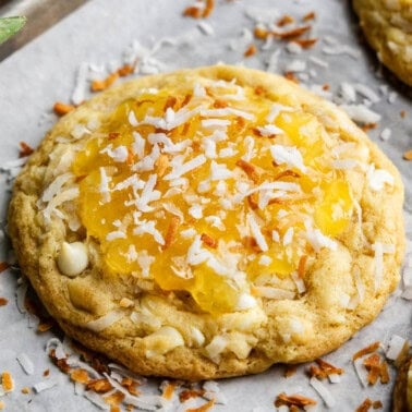 Angle shot of Bakery Style Pina Colada Cookies on a sheet pan.