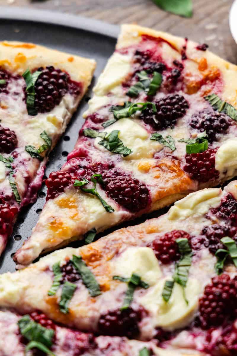 Close up of the berries on the Blackberry Basil Ricotta Pizza.