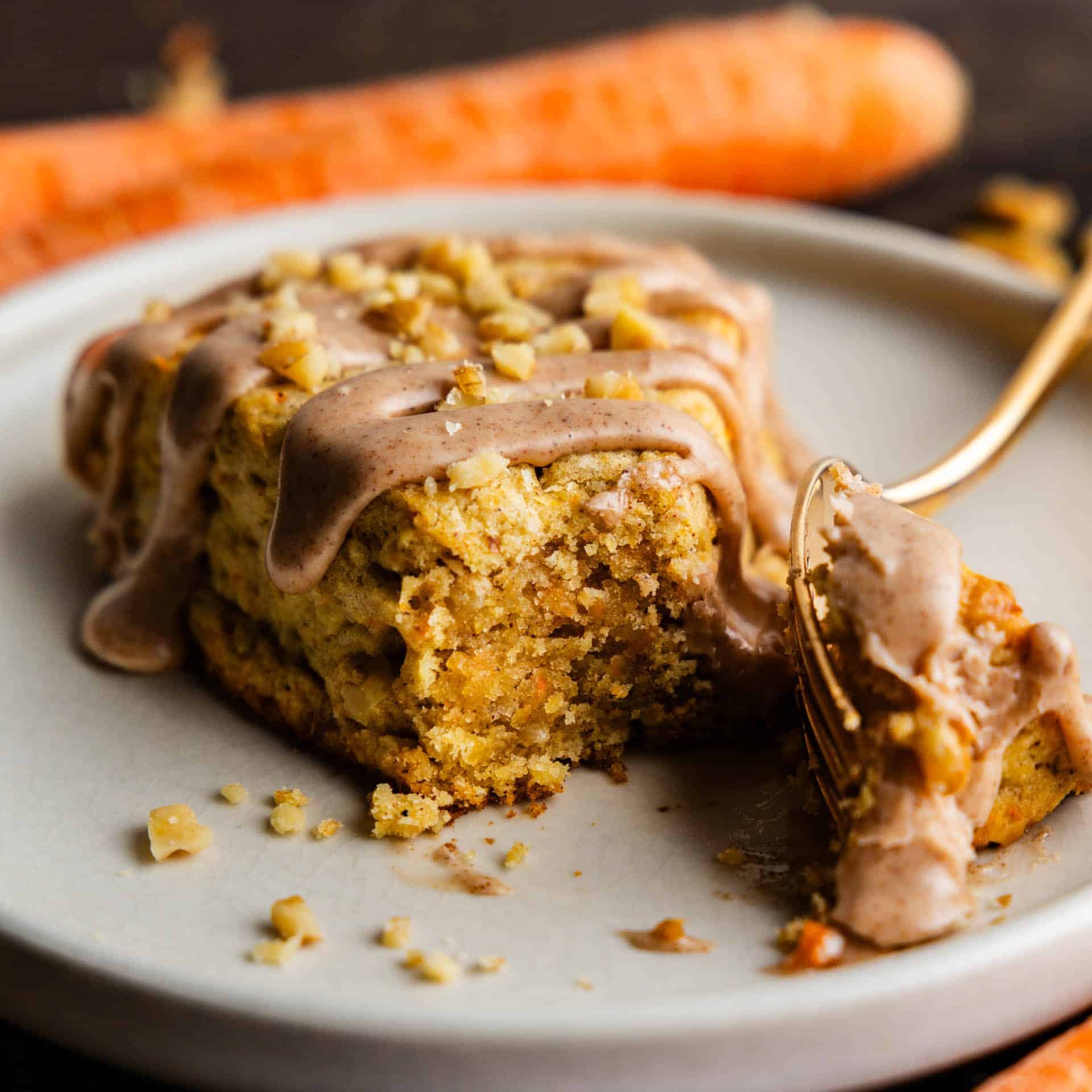 Fork taking a bite out of a Carrot Cake Scone.