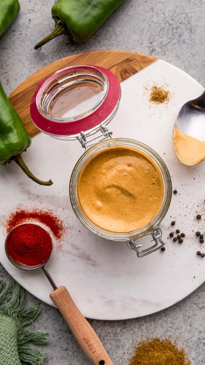 Overhead Image of Cowboy Dressing in a glass jar with ingredients surrounding it.