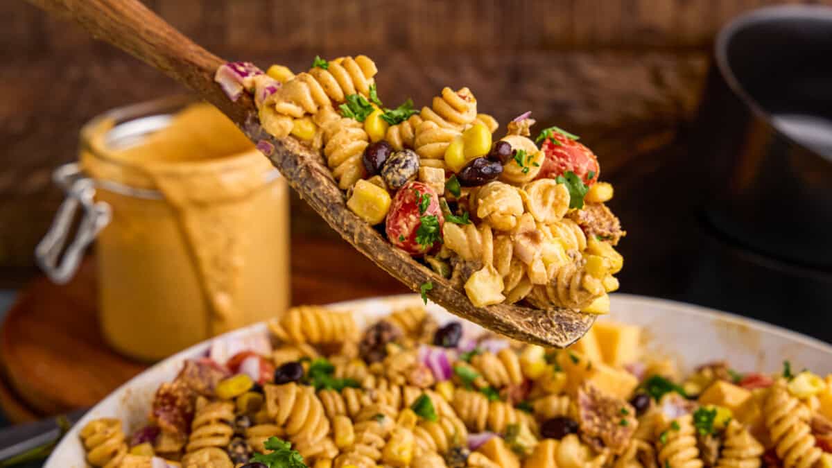 A wooden spoonful of Cowboy Pasta Salad.