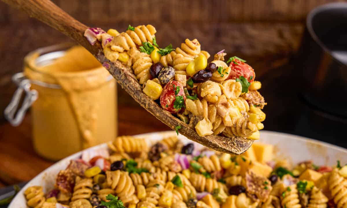 A wooden spoonful of Cowboy Pasta Salad.