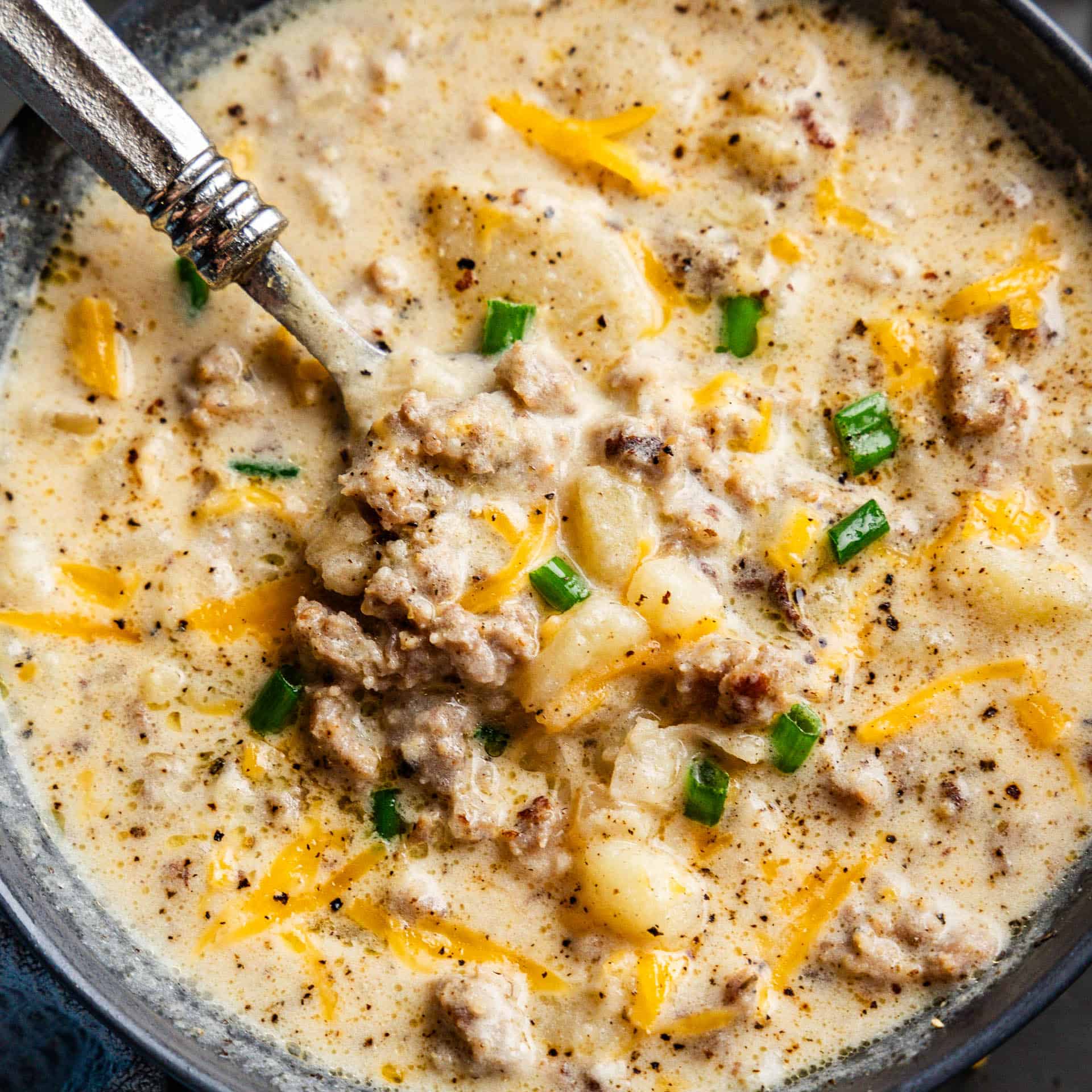 Closeup shot of Creamy Sausage Potato Soup in a bowl.