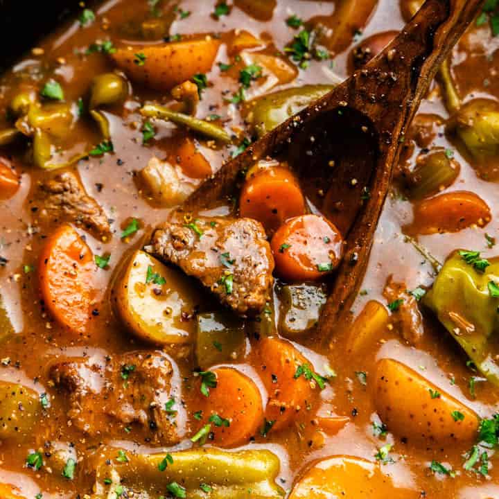 Closeup of Mississippi Beef Stew being scooped up in a ladle.