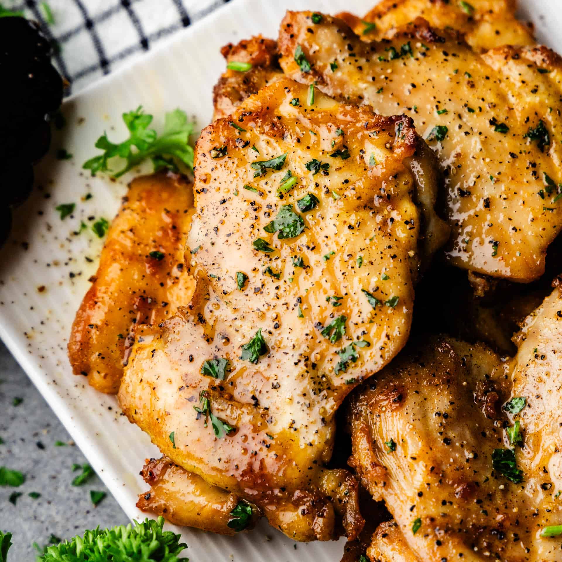 Sheet Pan Boneless Skinless Chicken Thighs piled on a platter.