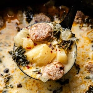 Closeup of ladle full of Zuppa Toscana.