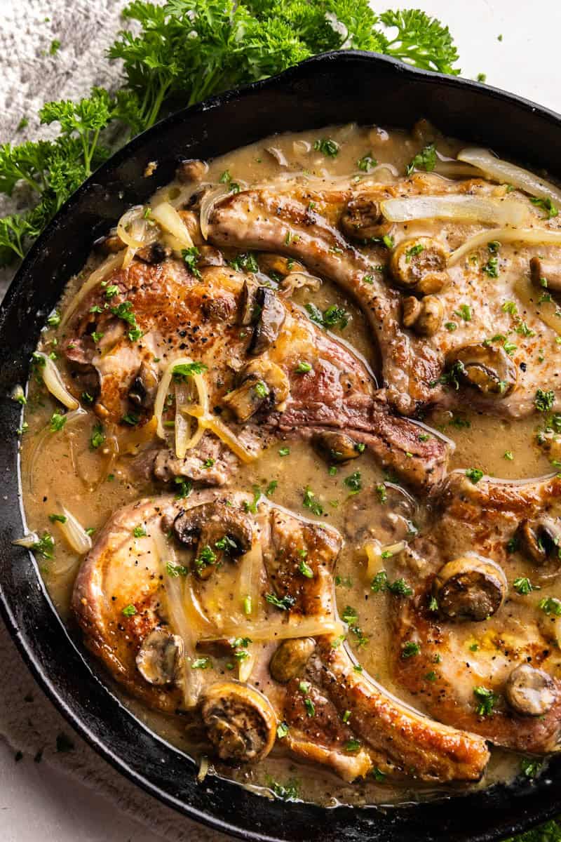 Smothered Pork Chops in a skillet.